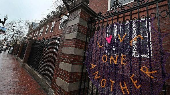 “Love One Another” sign hangs outside Harvard yard 